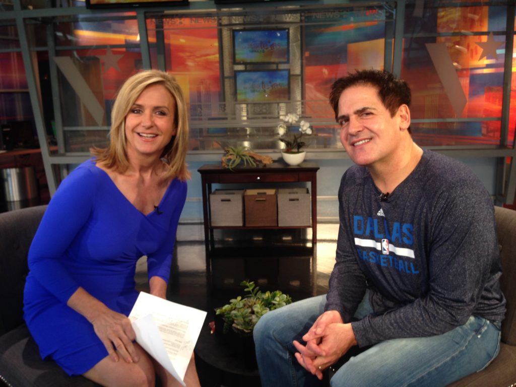 Jane McGarry poses with Mark Cuban during an interview